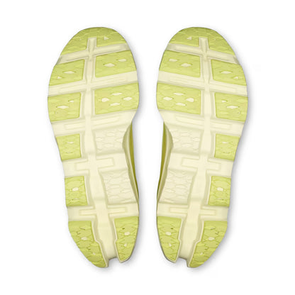 A pair of running shoe soles viewed from above, featuring a dual-tone design with light yellow-green and off-white sections in a grid pattern.