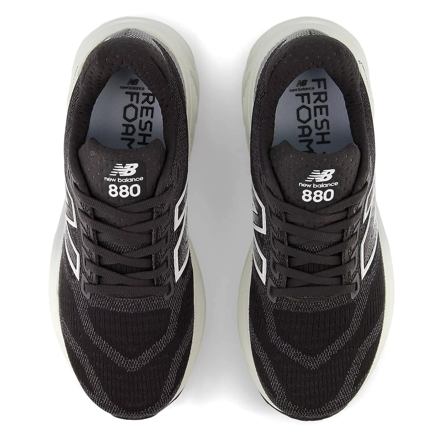 Black New Balance 880 sneakers on a white background