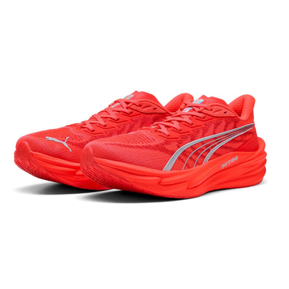 Red Puma running shoes with a visible brand logo on a white background