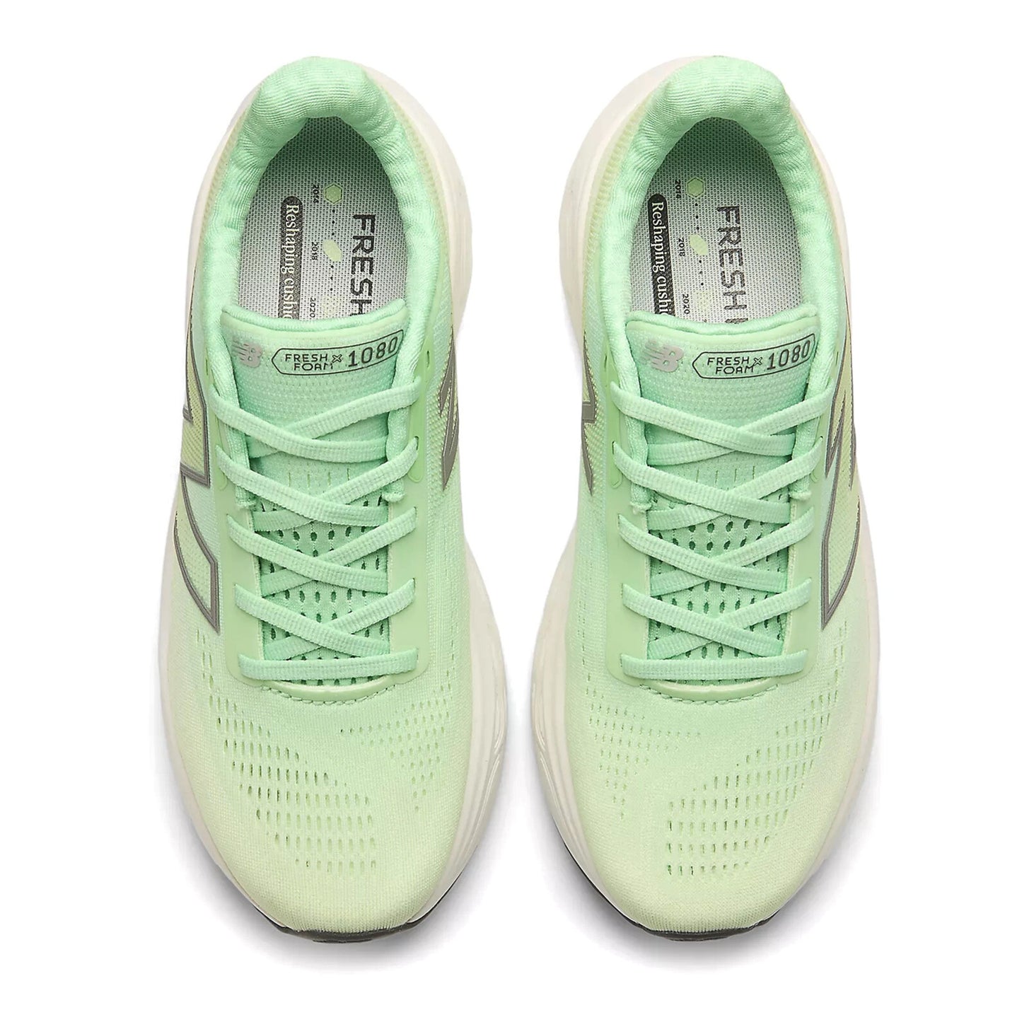 Pair of light green running shoes on a white background