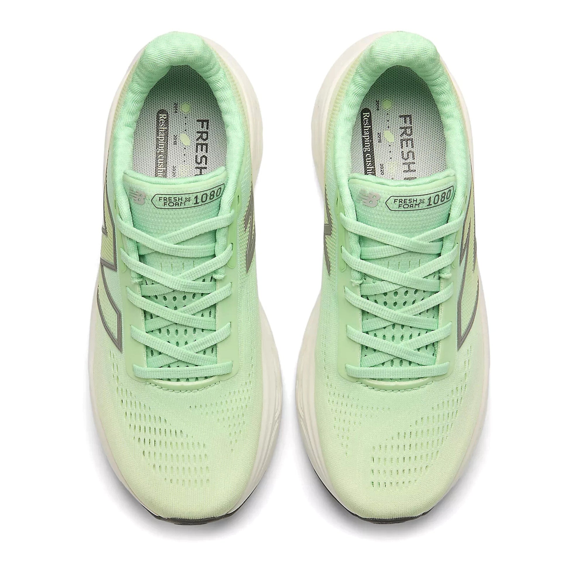 Pair of light green running shoes on a white background