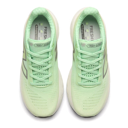 Pair of light green running shoes on a white background