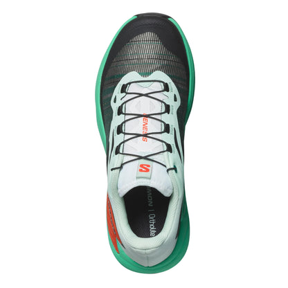 Green and black running shoe on a white background