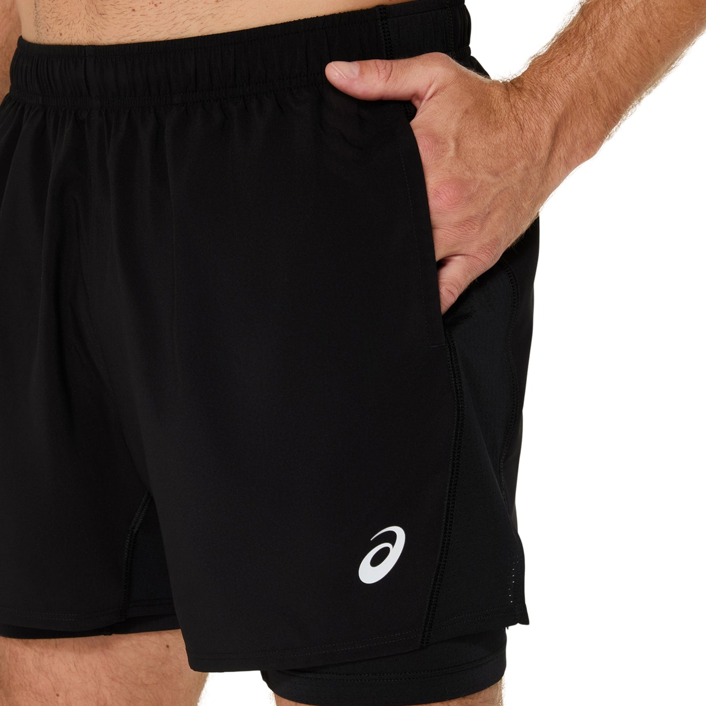 Black athletic shorts with a white logo on a white background