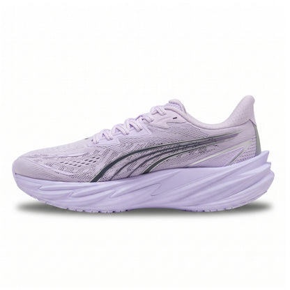 A light purple Puma running shoe with a thick, sculpted matching sole and a dark gray side stripe, shown from the side on a white background.