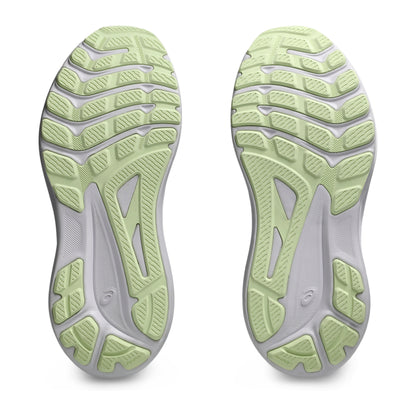 Close-up of a pair of green and gray athletic shoes on a white background