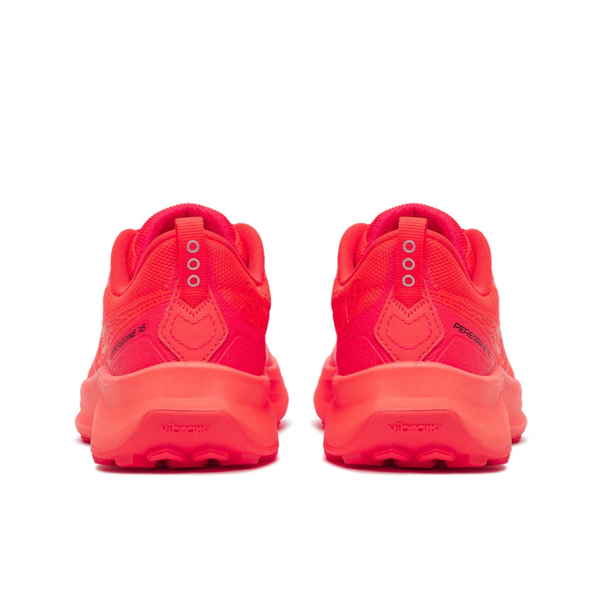 Pair of red Saucony running shoes on a white background