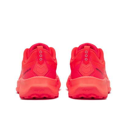 Pair of red Saucony running shoes on a white background