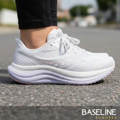 White running shoe with light purple sole a brand logo on a white background