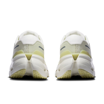 A pair of white and pale yellow-green On running shoe shown from the back, featuring a chunky sole and the 'on' logo on the sides, set against a plain white background.