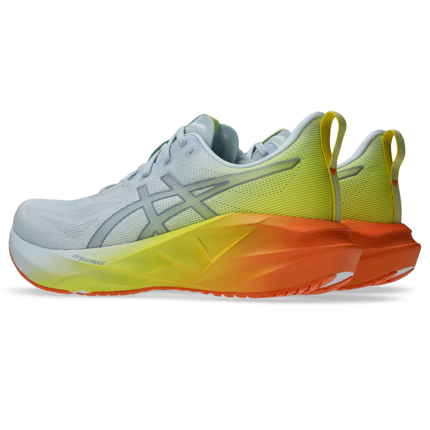 Pair of white and yellow Asics running shoes with orange accents on a white background