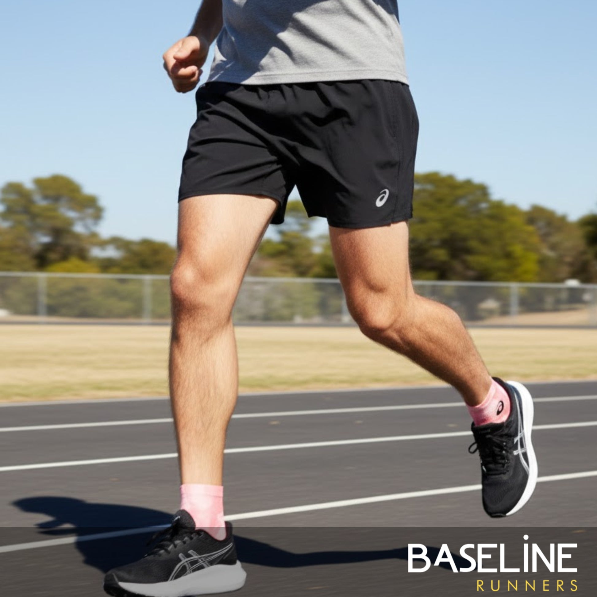 Man wearing running shorts with branded logo 