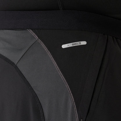 Close-up of a black and gray Asics shorts with 'ActiBreeze' label