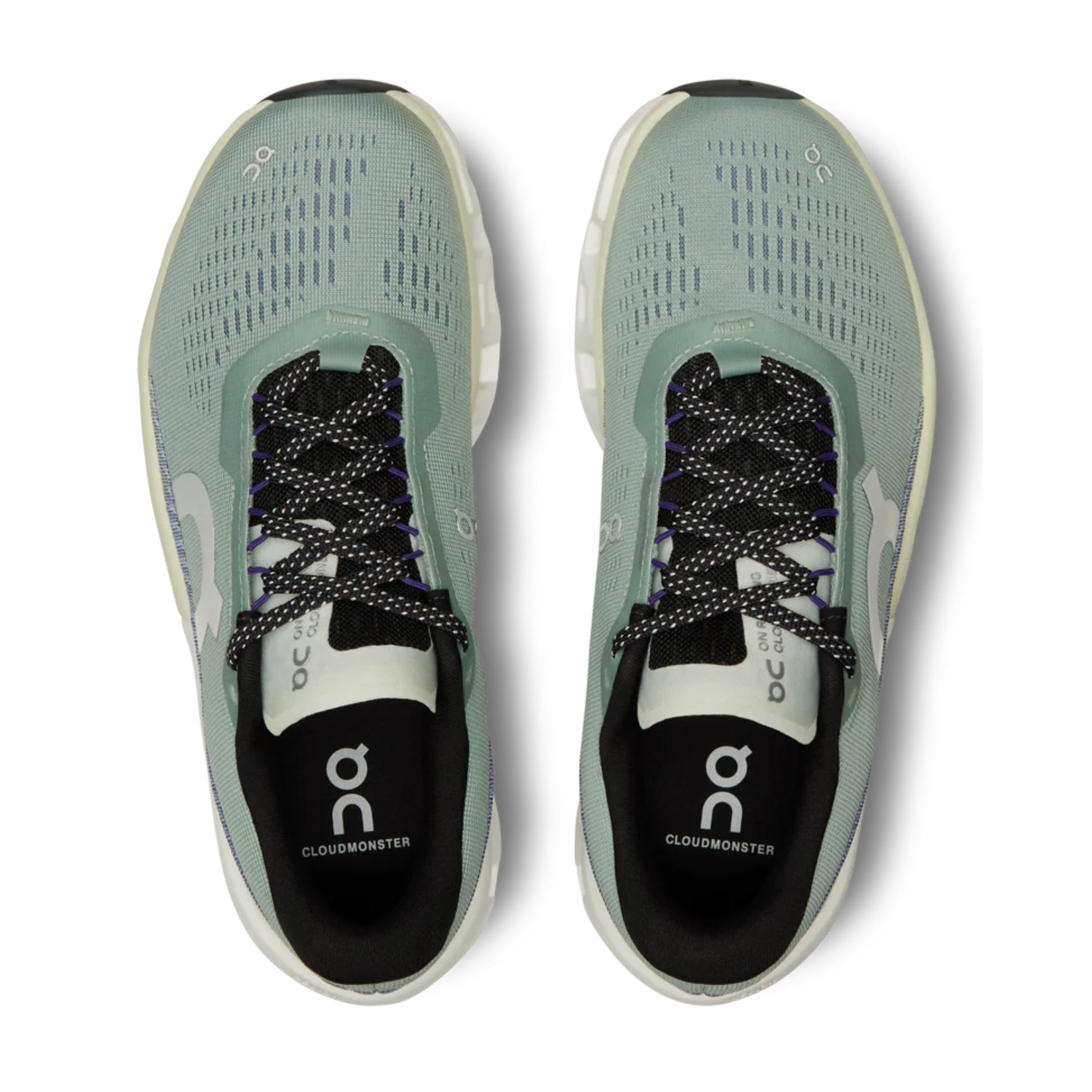 Pair of green running shoes with 'on' branding on a white background