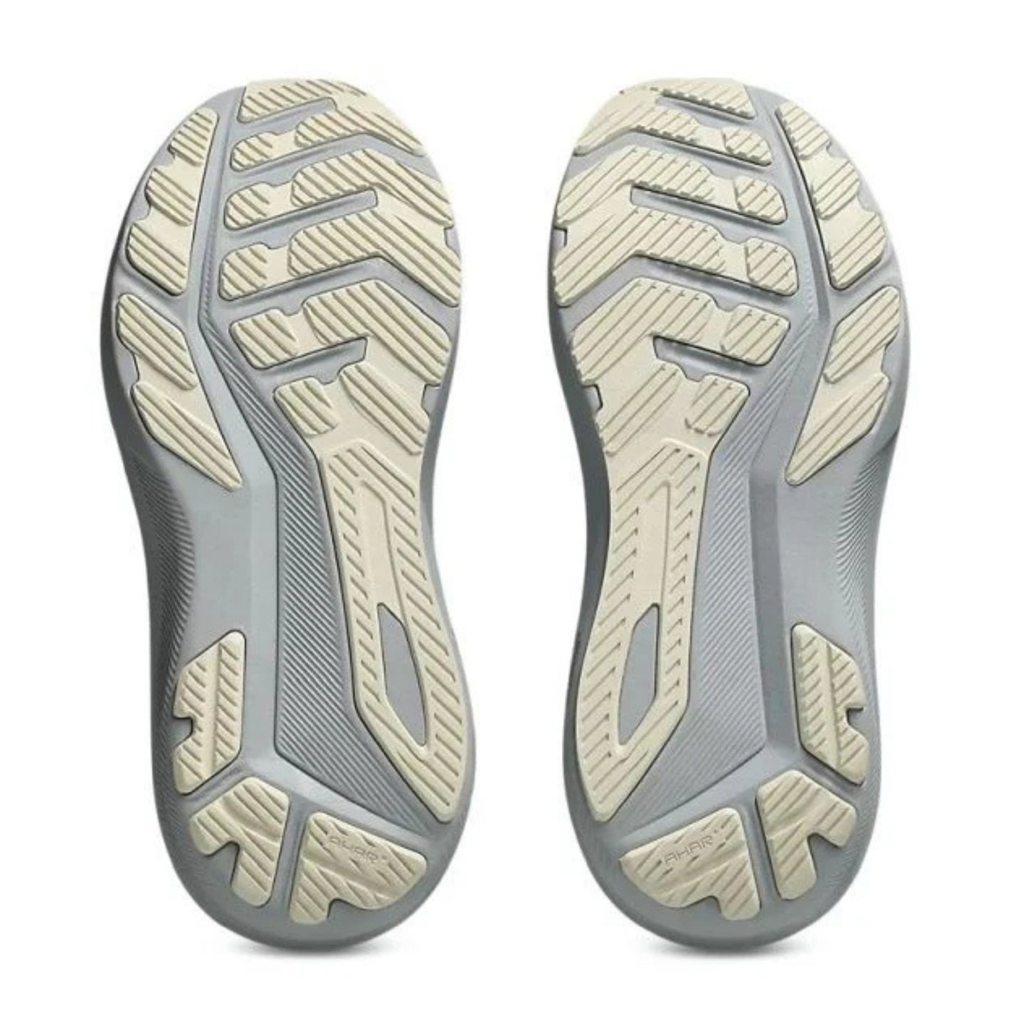 Close-up of a pair of gray and beige shoe soles on a white background