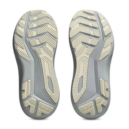 Close-up of a pair of gray and beige shoe soles on a white background