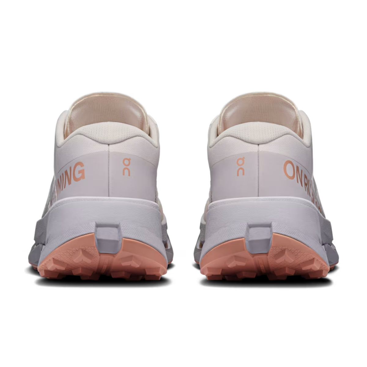 A pair of On Running trail shoes shown from the rear, featuring a light gray and off-white upper with peach-colored midsoles and outsoles, and the On logo visible.