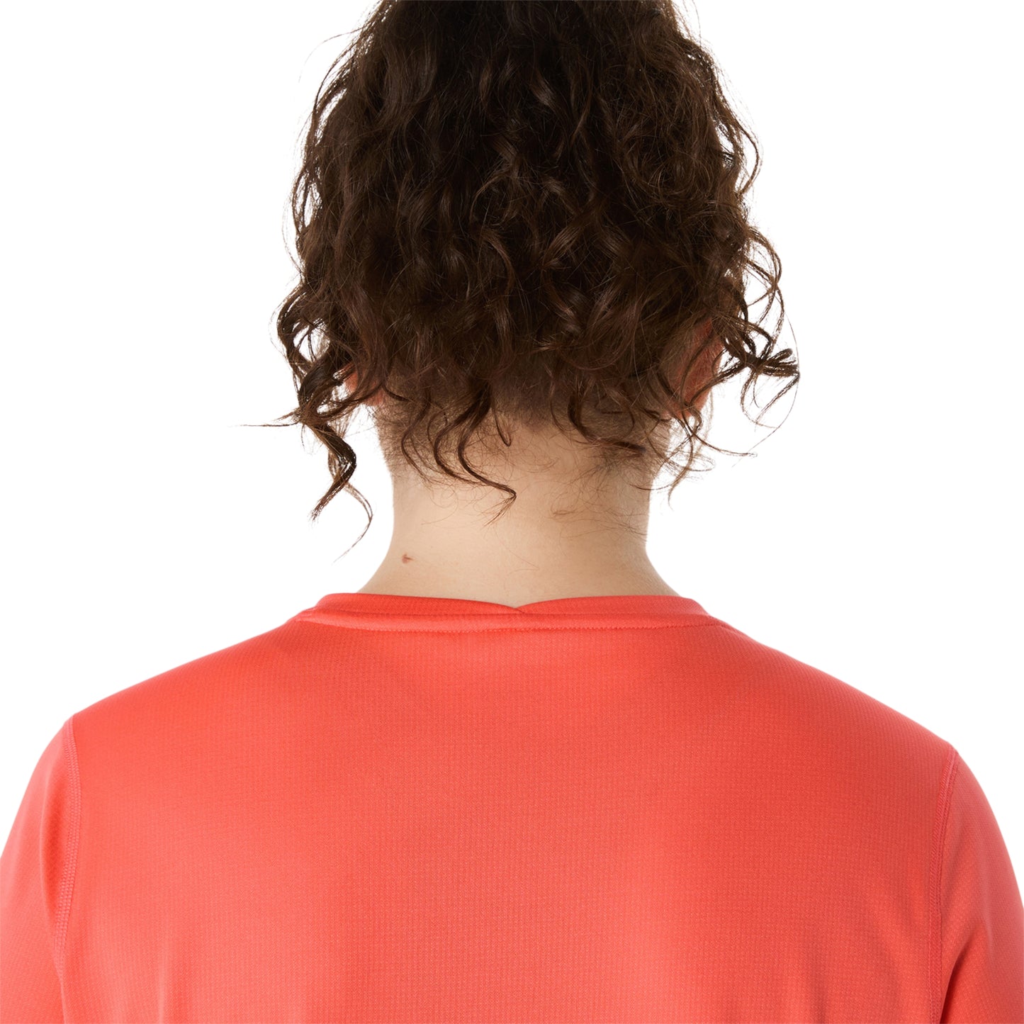 Close-up of a person wearing coral shirt on a white background