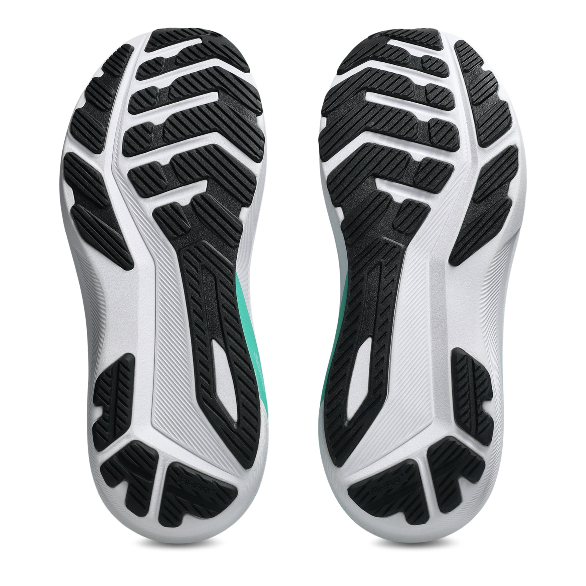 Close-up of a pair of shoes with a focus on the sole design on a white background