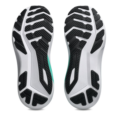 Close-up of a pair of shoes with a focus on the sole design on a white background