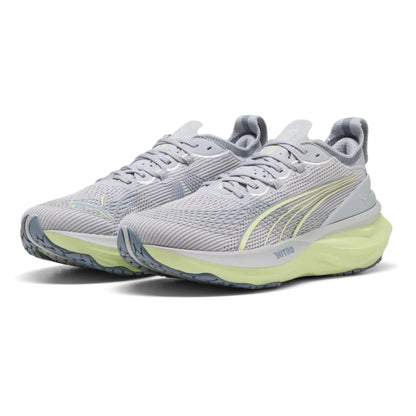 Pair of gray Puma running shoes with yellow accents on a white background