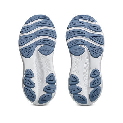 A pair of running shoe soles viewed from the bottom, featuring a dual-tone design with white and blue sections in a grid pattern.