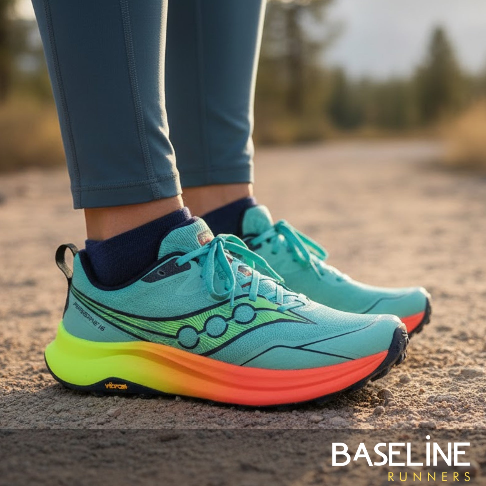 Blue, orange and yellow running shoes on a trail road 