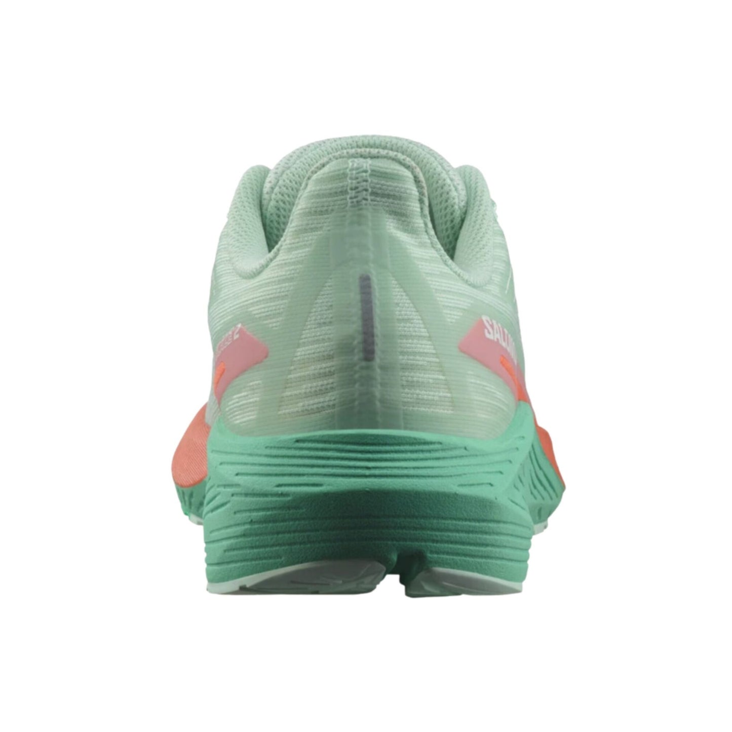 Green running shoe with pink accents on a white background