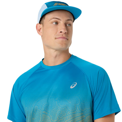 Close-up of a Person wearing blue and yellow Asics running shirt on a white background