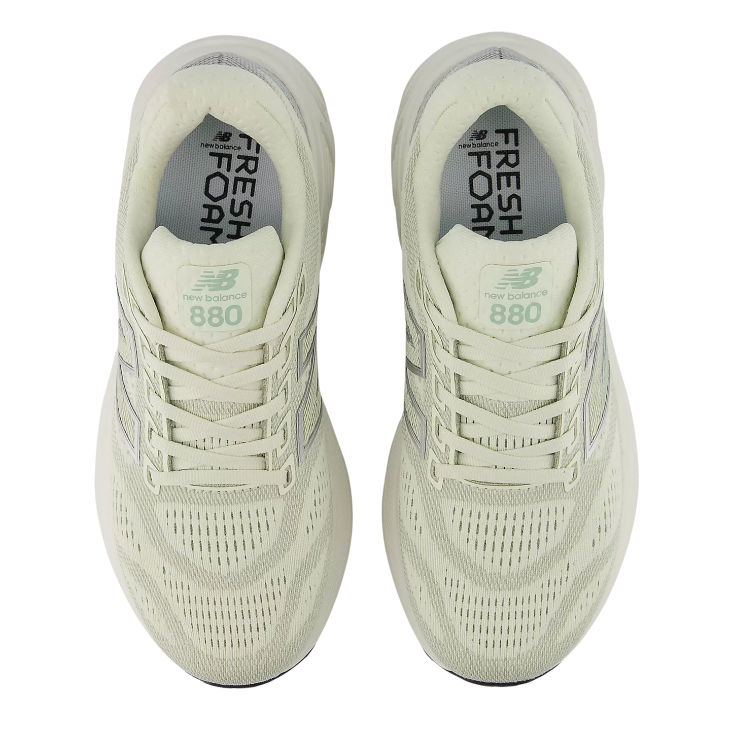 Pair of light green running shoes with 'Fresh Foam' and 'New Balance' branding on a white background