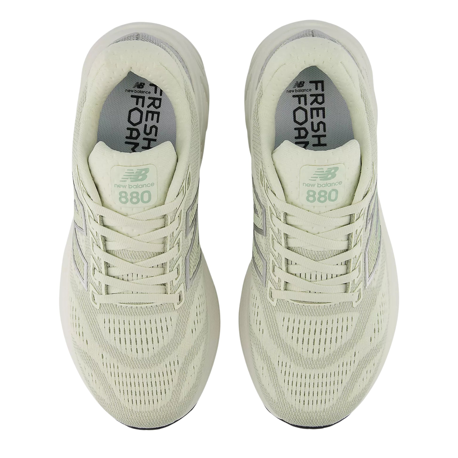Pair of light green running shoes with 'Fresh Foam' and 'New Balance' branding on a white background