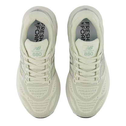 Pair of light green running shoes with 'Fresh Foam' and 'New Balance' branding on a white background