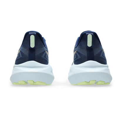 Blue running shoes with white soles and green accents on a white background