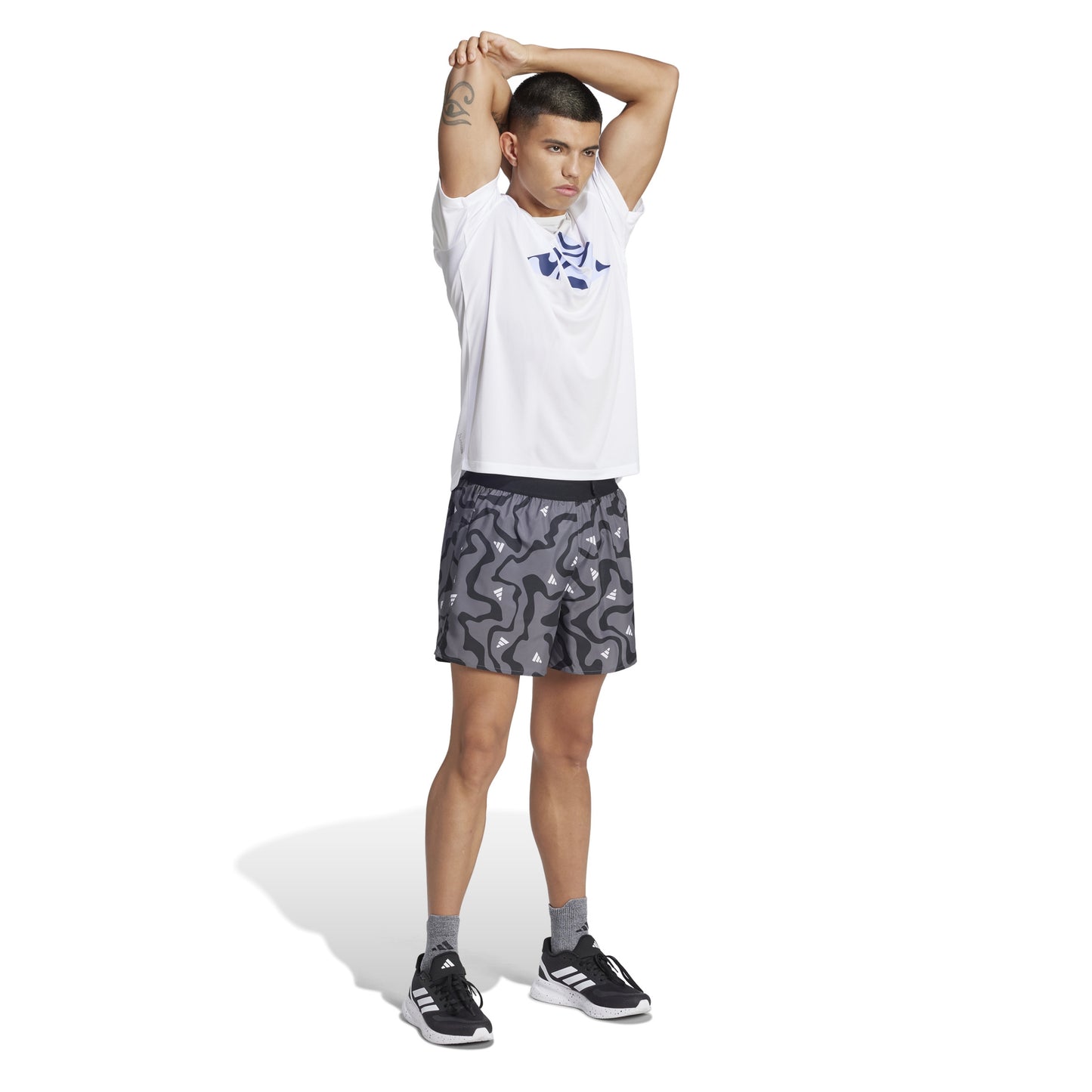 Man wearing Adidas grey patterned short 