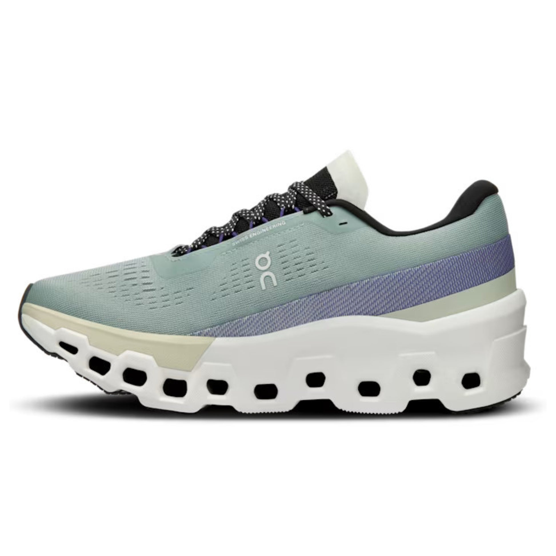 Green running shoe with white sole on a white background