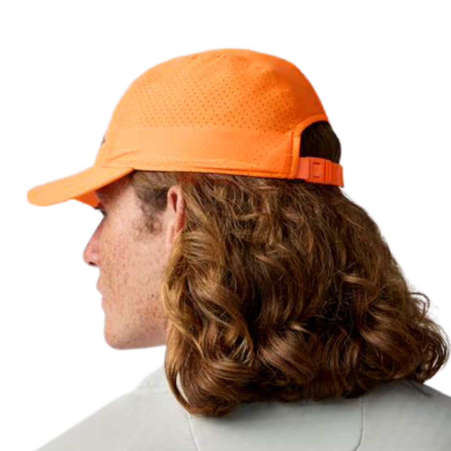 Man wearing a orange cap with a black Brooks logo on a white background