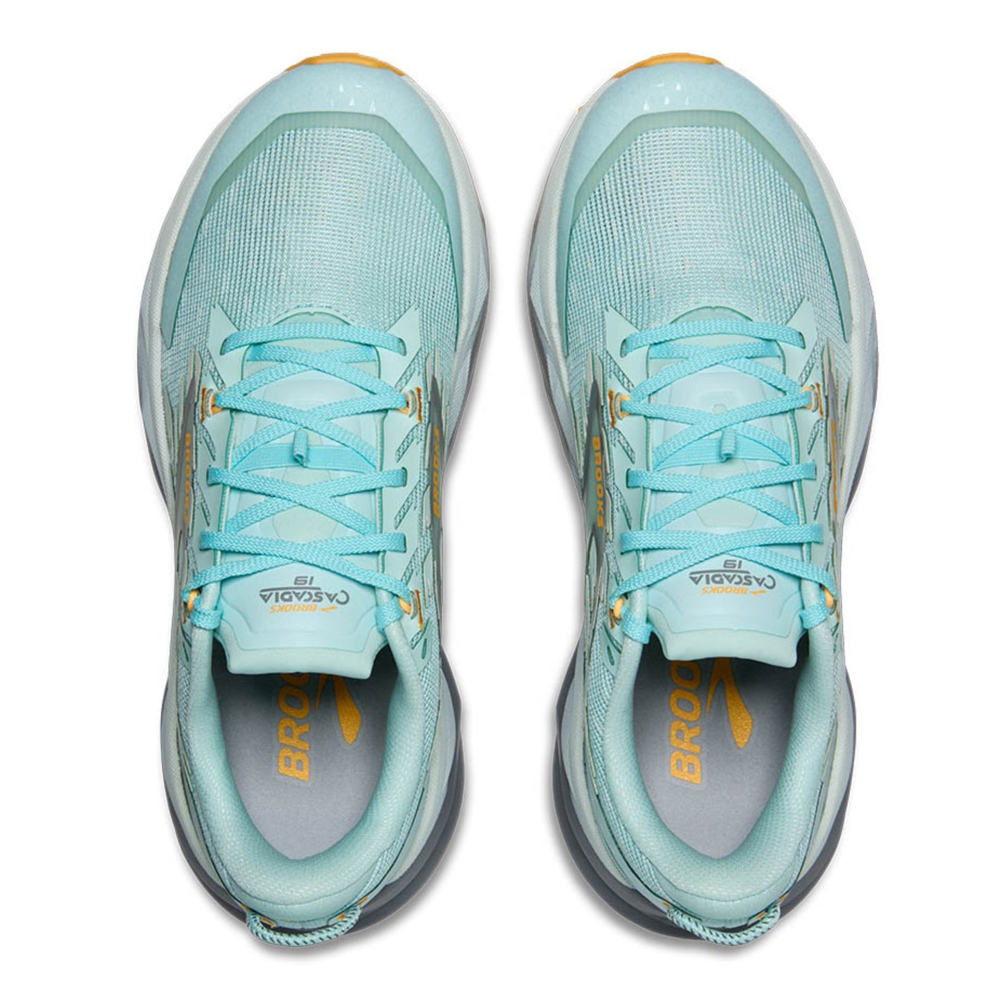 Pair of light blue running shoes with yellow accents on a white background