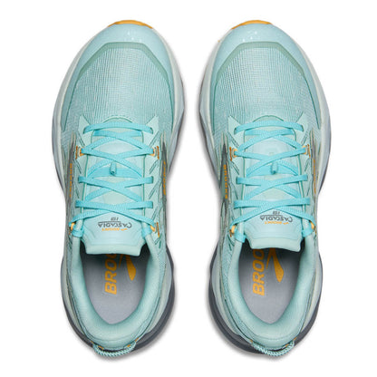 Pair of light blue running shoes with yellow accents on a white background