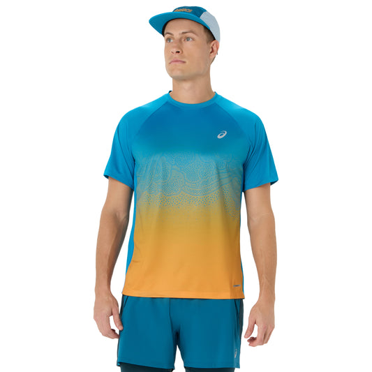 Person wearing blue and yellow Asics running shirt on a white background