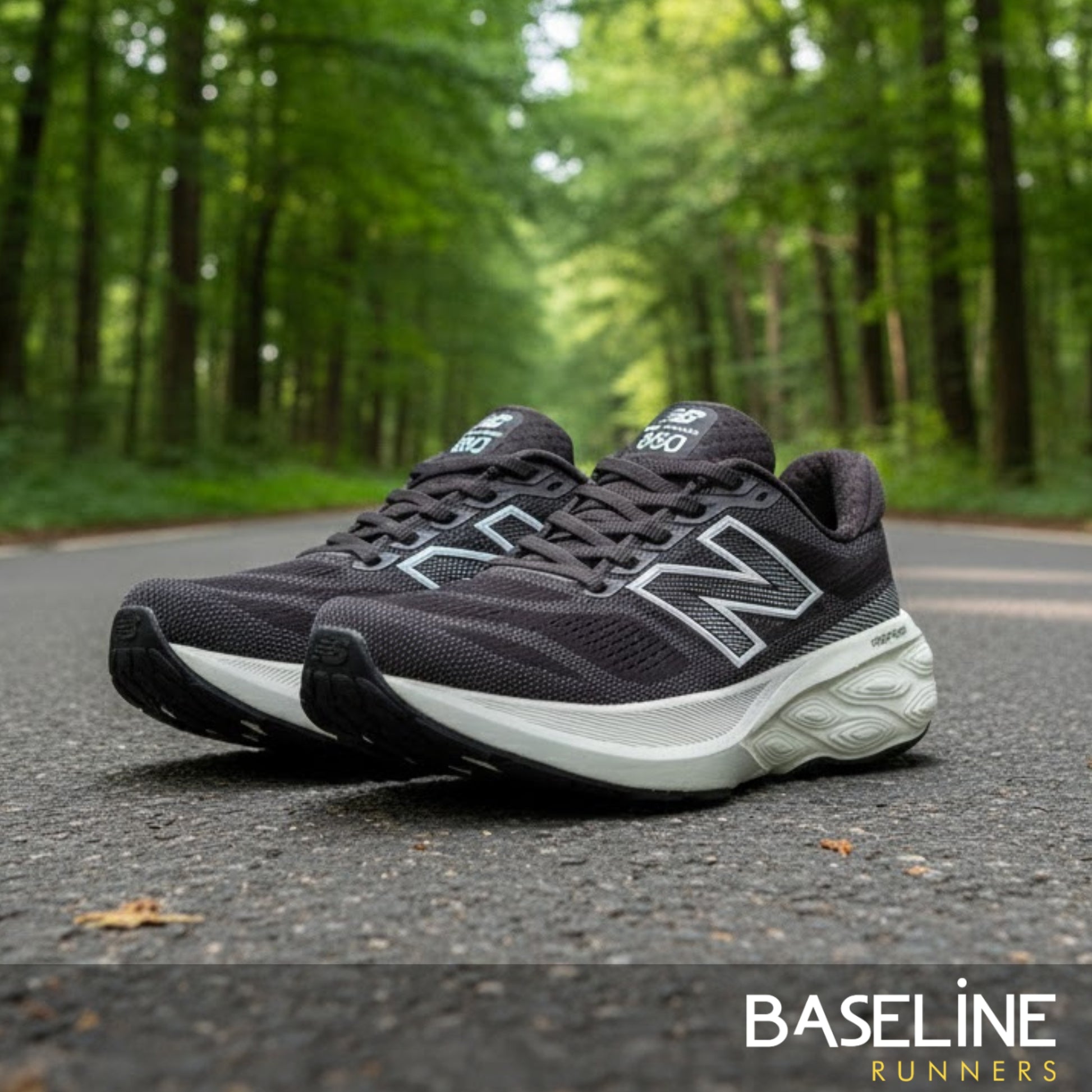 Black running shoes on a road with greenery in the background, featuring the 'Baseline Runners' brand.