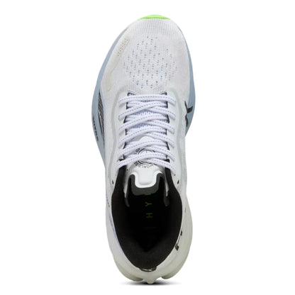 White Puma running shoe with black sole on a white background
