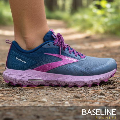 Blue and purple running shoe on a natural path with 'Baseline Runners' branding.