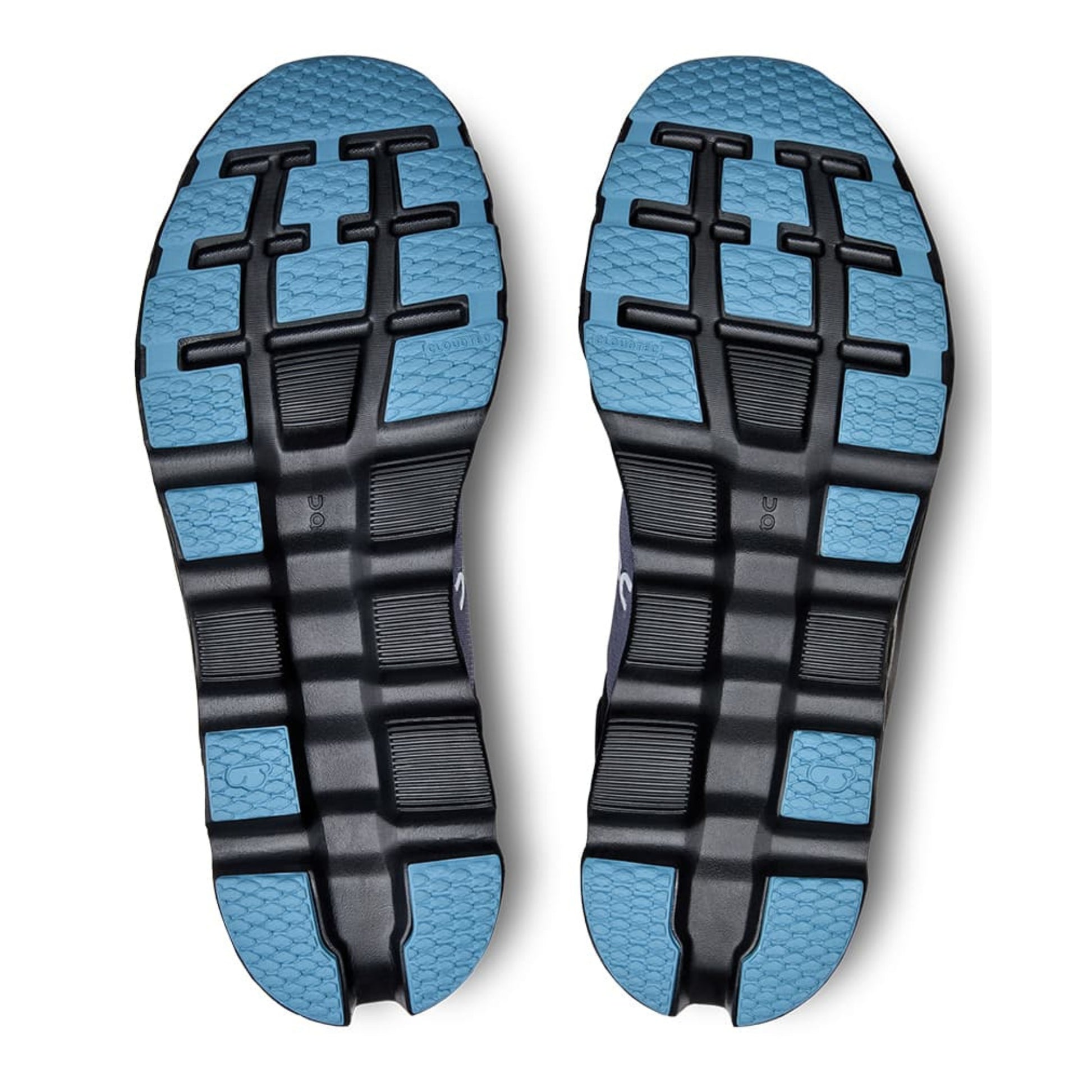 Close-up of blue and black shoe soles on a white background