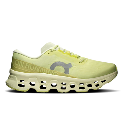 A single On running shoe in a pale yellow-green colorway, featuring a textured mesh upper, a chunky sculpted sole with cutouts, and a gray On logo on the side. The word 'ON' is printed in gold on the heel.