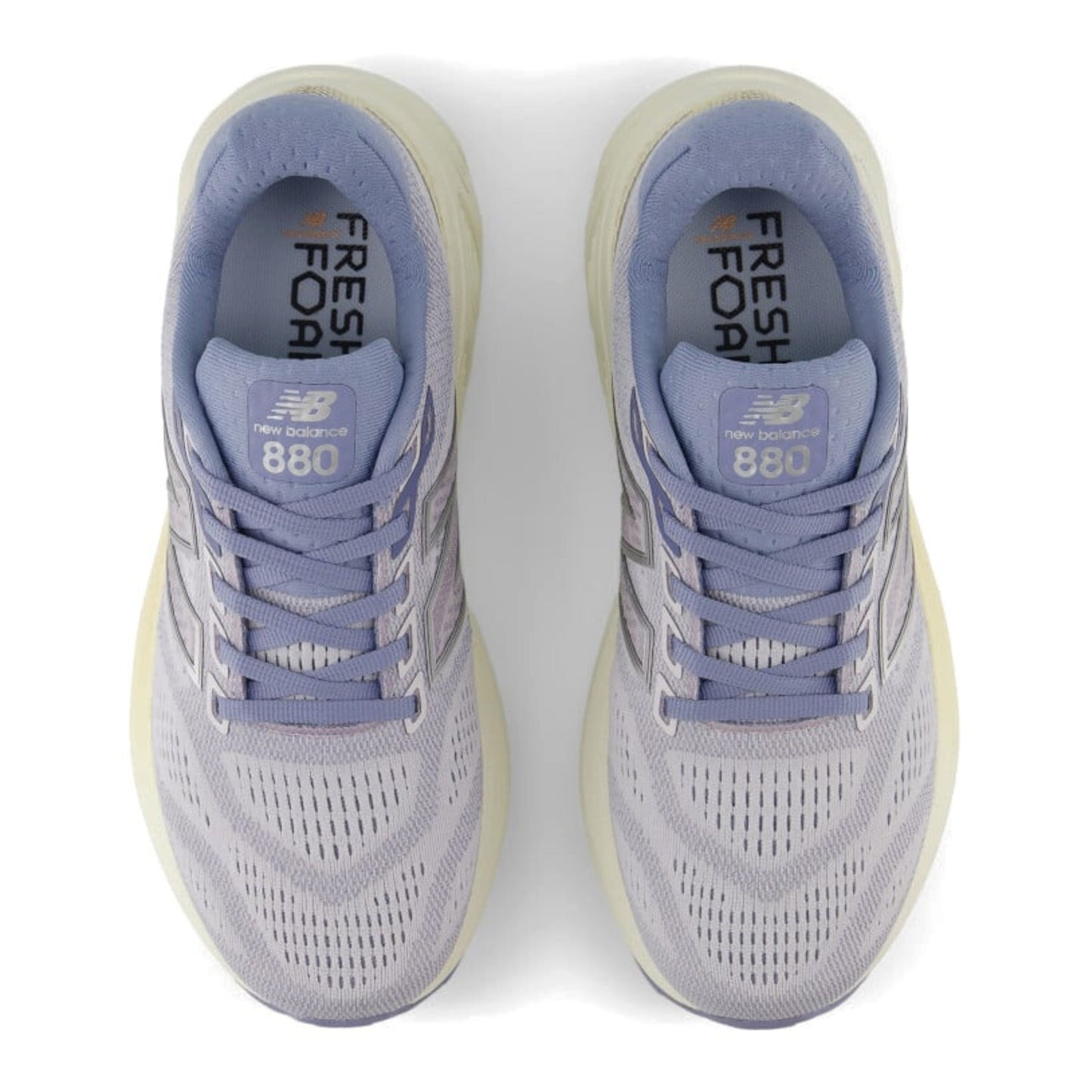 Pair of Light Purple New Balance 880v11 running shoes on a white background