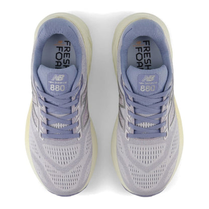 Pair of Light Purple New Balance 880v11 running shoes on a white background