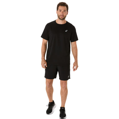 Man wearing a black t-shirt and running shorts with a visible brand logo on a white background