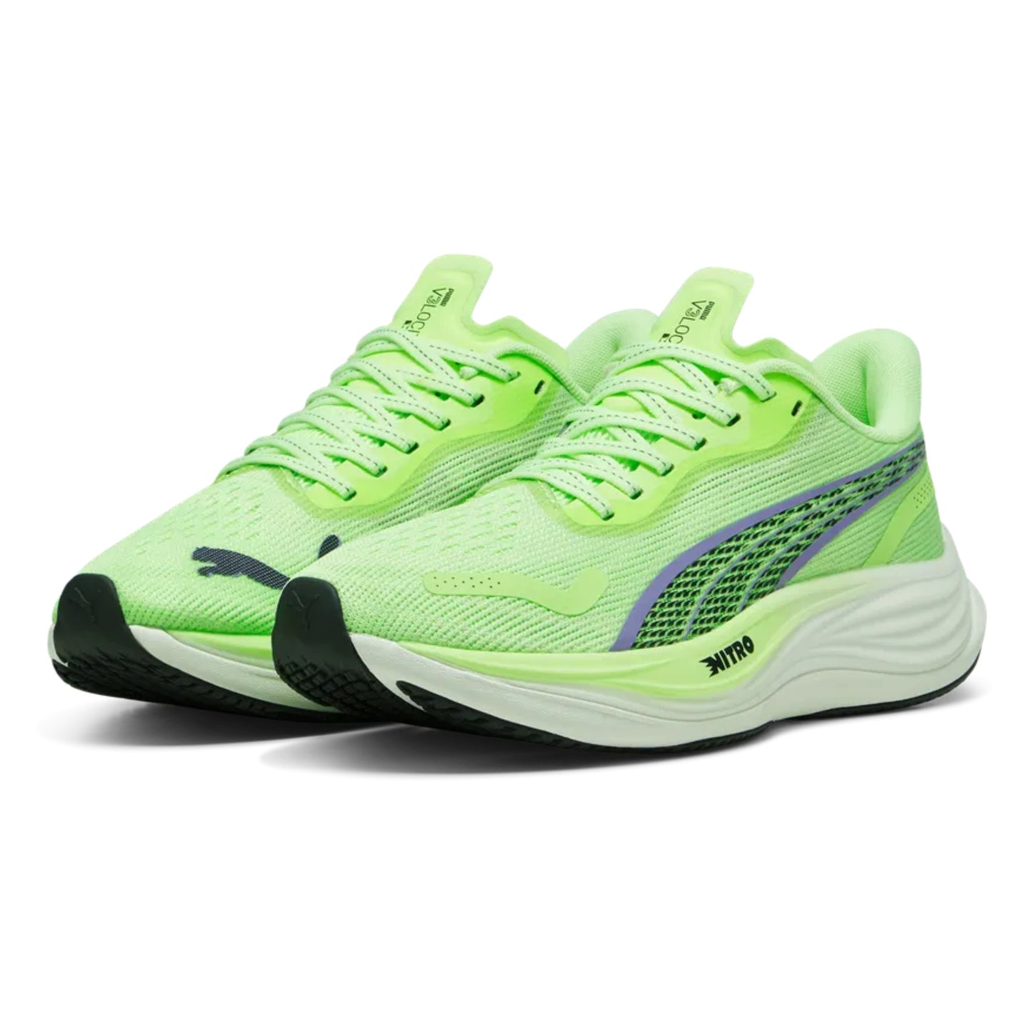 Pair of bright green Puma running shoes on a white background