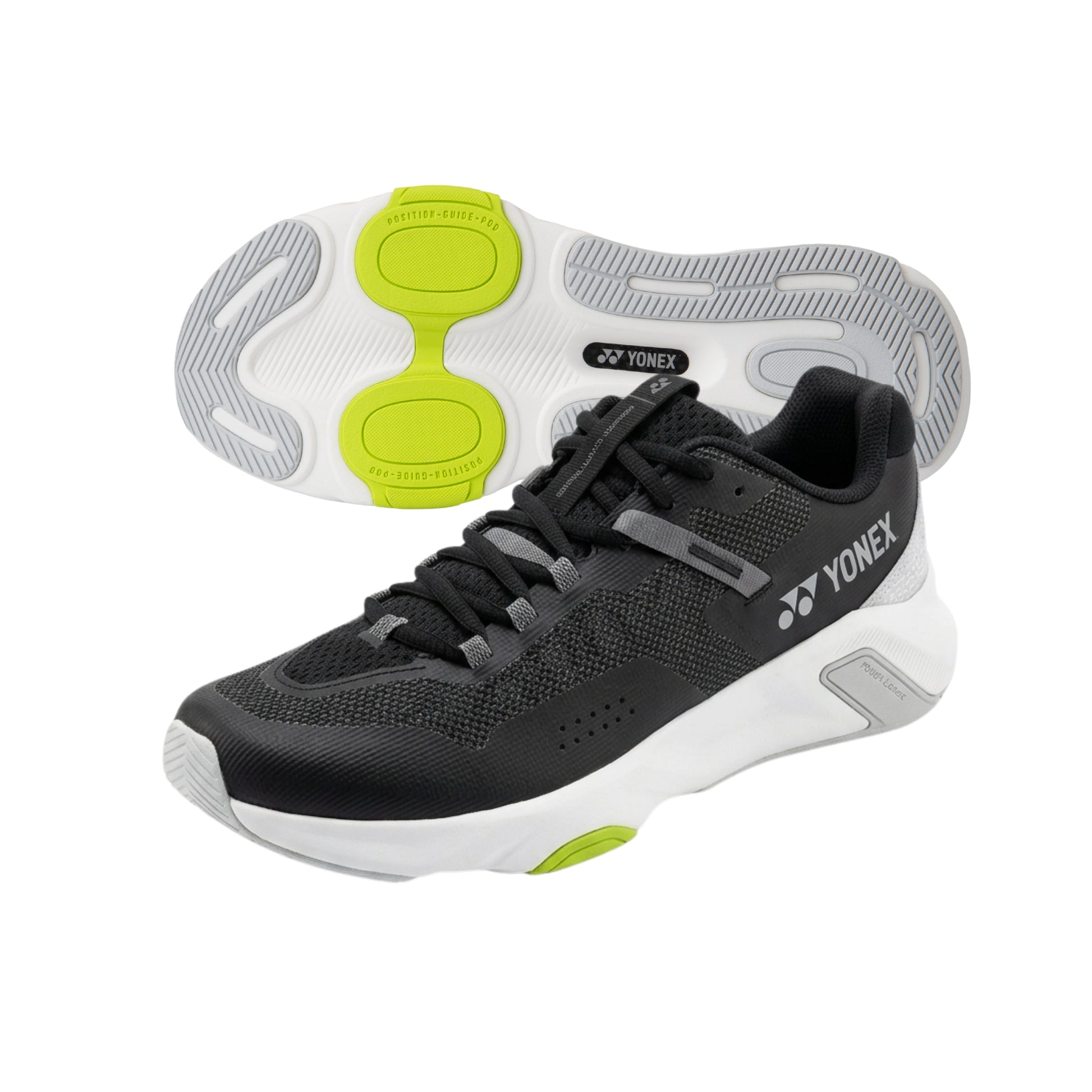 Black and gray Yonex running shoe with green accents on a white background