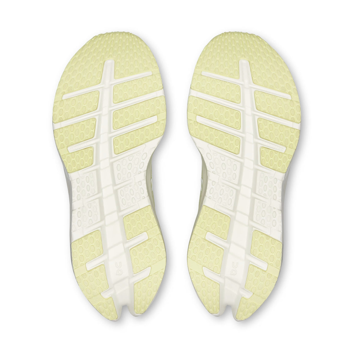 Top-down view of a pair of On running shoes showing their light yellow and white sole patterns against a white background.